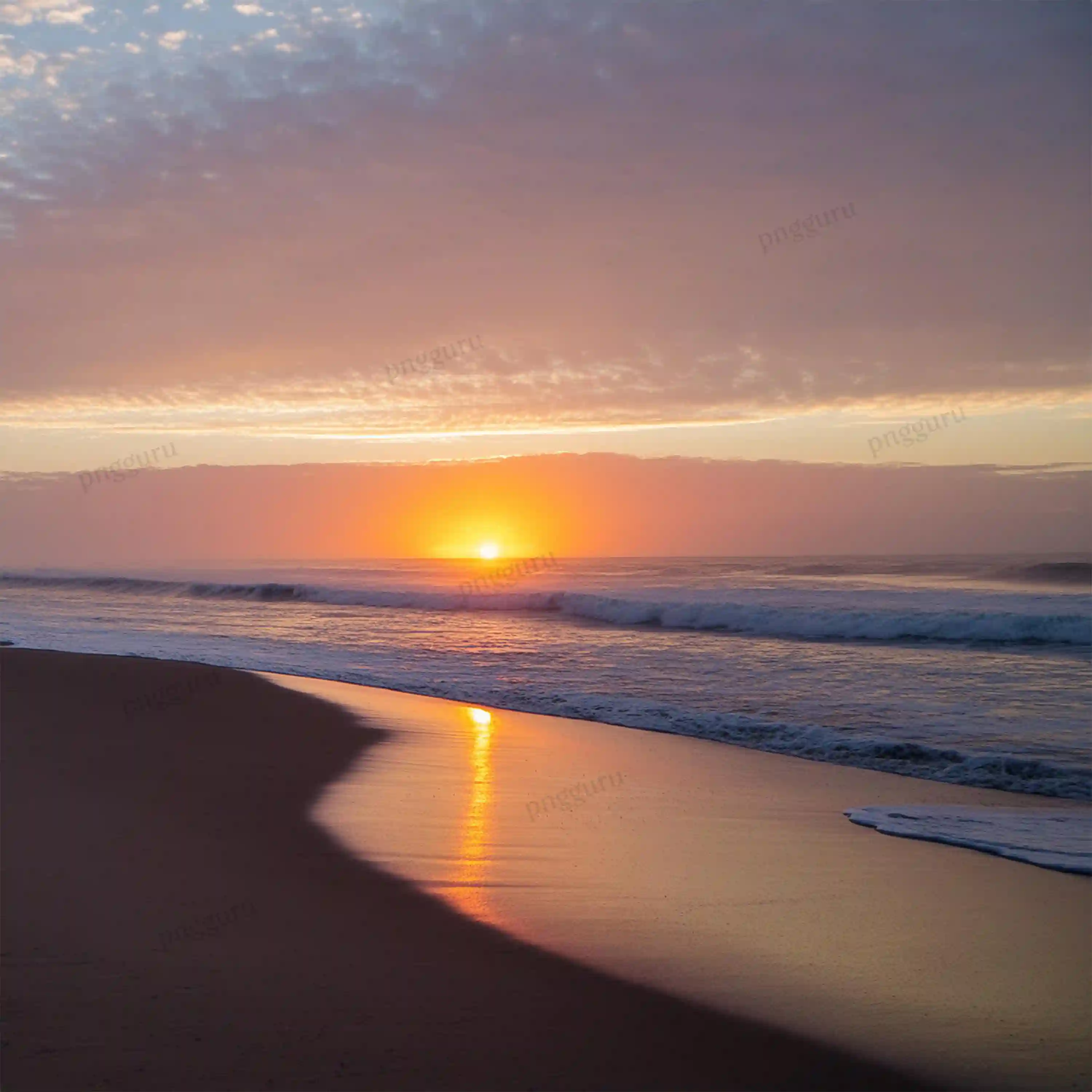A sunrise on the beach with waves and sand